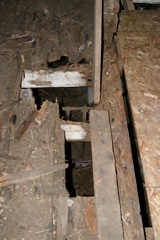 Closer picture of the joint between the new and old barn.  Note this rotted out beam is supposedly holding up part of the barn!