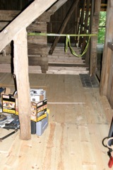 new flooring in the front and center section of the barn!  Center section needs 2x10's on top to be completed..

(The steal panel is due to a roof leak...)