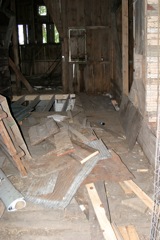 Lots of scrap on the floor, but you can start to see the new joists after things have been reframed...