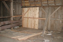 View from inside of the barn, with siding installed