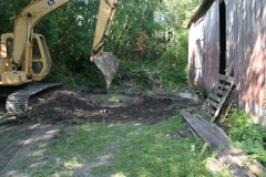 filling in the hole, and regrading the area...